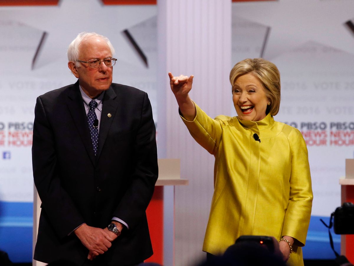 Democratic presidential candidates Sen. Bernie Sanders, I-Vt, left, and Hillary Rodham Clinton take the stage before a Democratic presidential primary debate at the University of Wisconsin-Milwaukee, Thursday, Feb. 11, 2016, in Milwaukee.  ((AP Photo/Morry Gash))