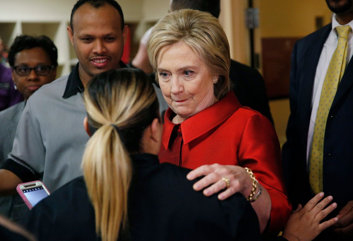 Democratic presidential candidate Hillary Clinton speaks with a Harrah's Las Vegas employee on the day of the Nevada Democratic caucus, Saturday, Feb. 20, 2016, in Las Vegas. (AP Photo/John Locher) (AP)