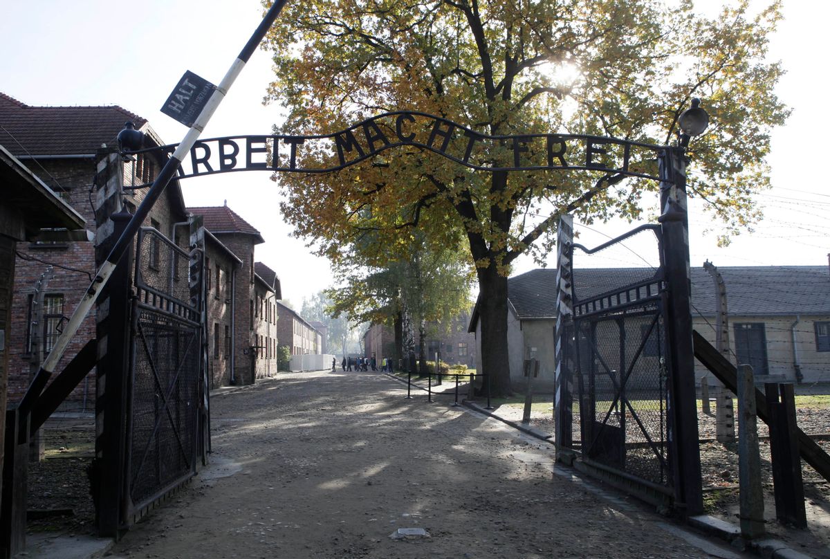 FILE - In this Oct. 19, 2012 file photo the entrance  with the inscription "Arbeit Macht Frei" (Work Sets You Free) gate of the former German Nazi death camp of Auschwitz is pictured at the Auschwitz-Birkenau memorial in Oswiecim, Poland. A 94-year-old former SS guard at the Auschwitz death camp is going on trial Thursday, Feb. 11, 2016 on 170,000 counts of accessory to murder, the first of up to four cases being brought to court this year in an 11th-hour push by German prosecutors to punish Nazi war crimes.  (AP)