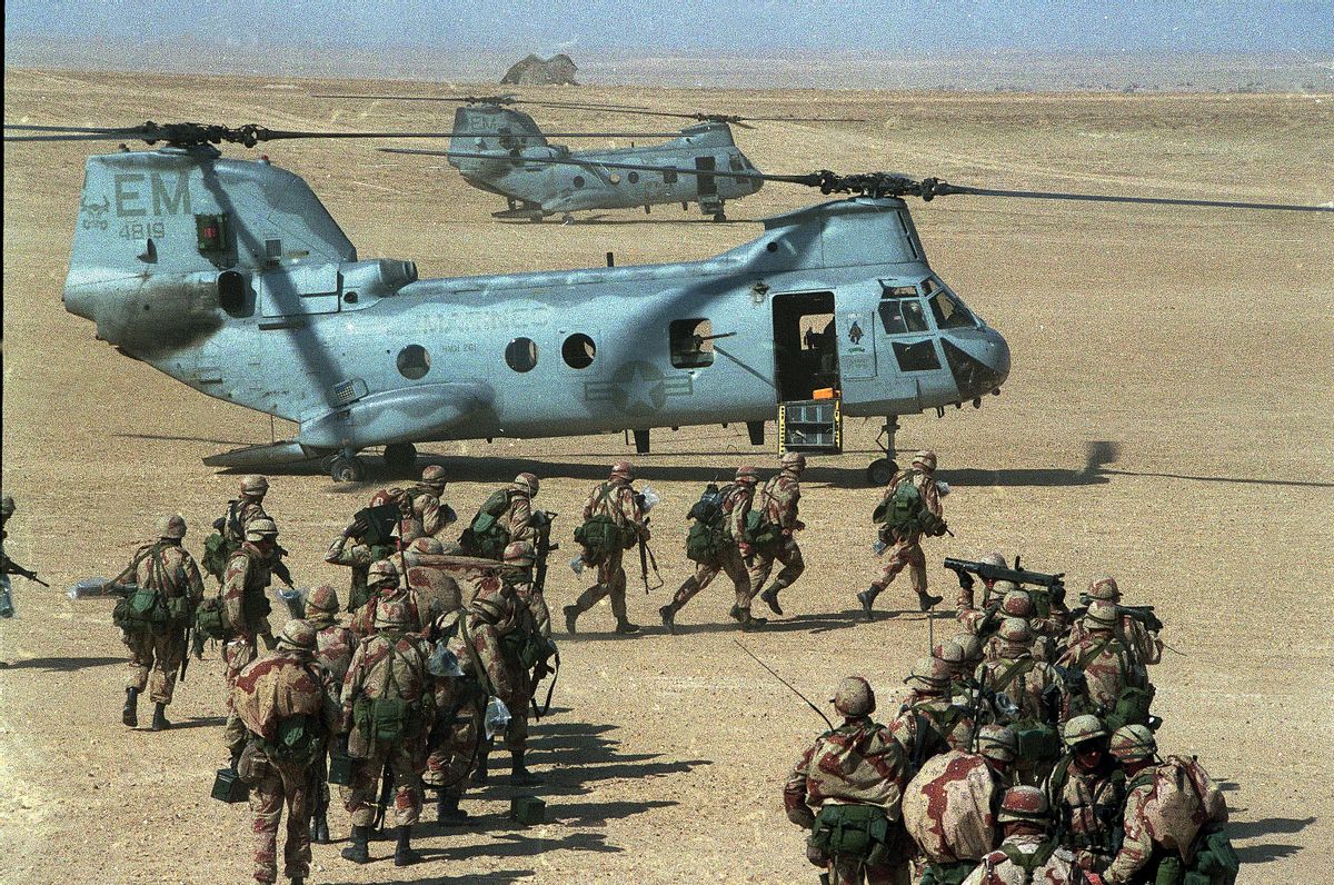 FILE -- In this Feb. 12, 1991 file photo, U.S. Marines prepare to board Chinook CH-46 helicopters during a deployment exercise in the desert of Saudi Arabia during the Persian Gulf crisis. Twenty five years after the first U.S. Marines swept across the border into Kuwait in the 1991 Gulf War, American forces find themselves battling the extremist Islamic State group, born out of al-Qaida, in the splintered territories of Iraq and Syria. (AP Photo/Sadayuki Mikami, File) (AP)