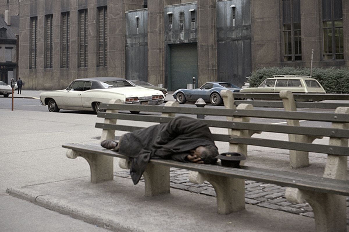A homeless man sleeps on a bench outside the Manhattan House of Detention, also known as The Tombs, Oct. 31, 1970.    (AP/Ed Ford)