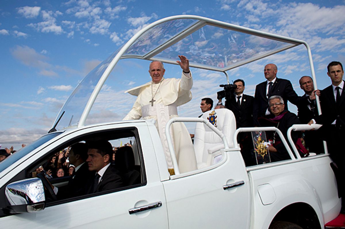 Pope Francis waves as he arrives in Paraguay, Sunday, July 12, 2015.   (AP/Victor R. Caivano)