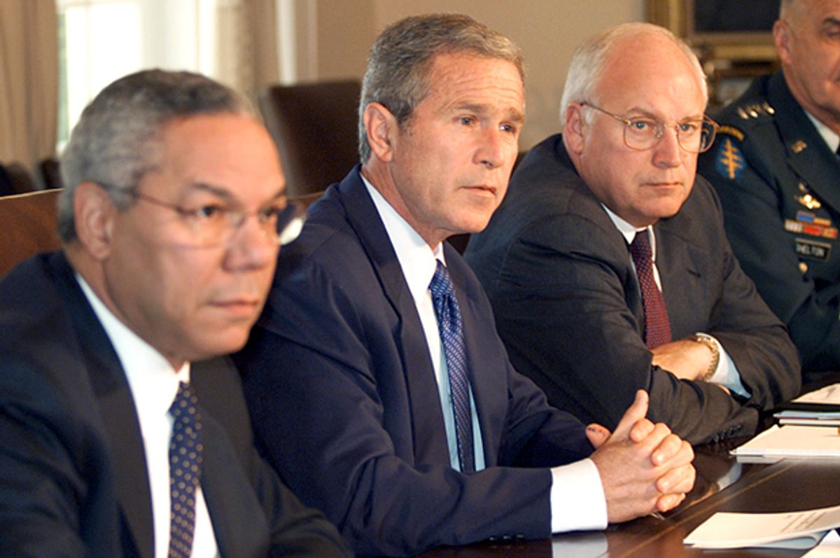Colin Powell, George W. Bush and Dick Cheney attend a meeting in the Cabinet Room of the White House, September 12, 2001.   (Reuters/Kevin Lamarque)