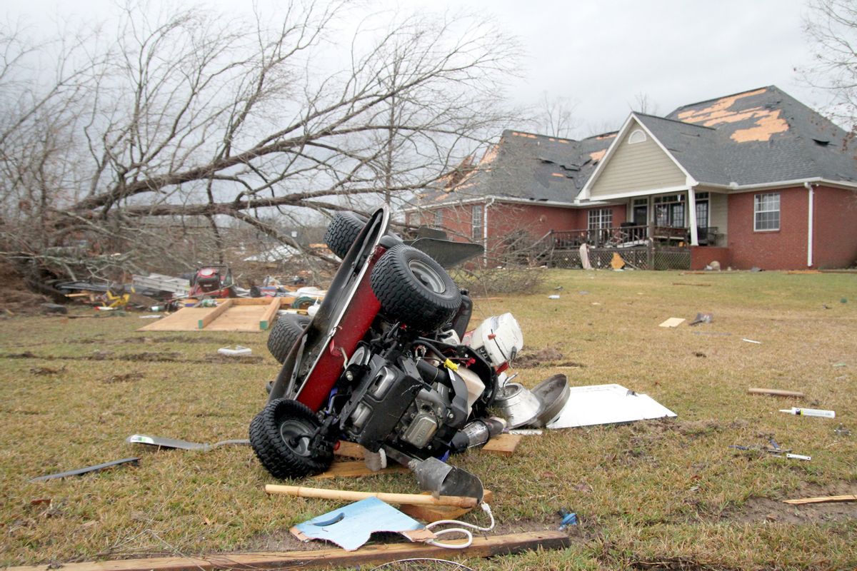 A riding lawn mower lies on the ground after a storm in Collinsville, Miss., Tuesday, Feb. 2, 2016.  (Paula Merritt /The Meridian Star via AP) MANDATORY CREDIT (AP)