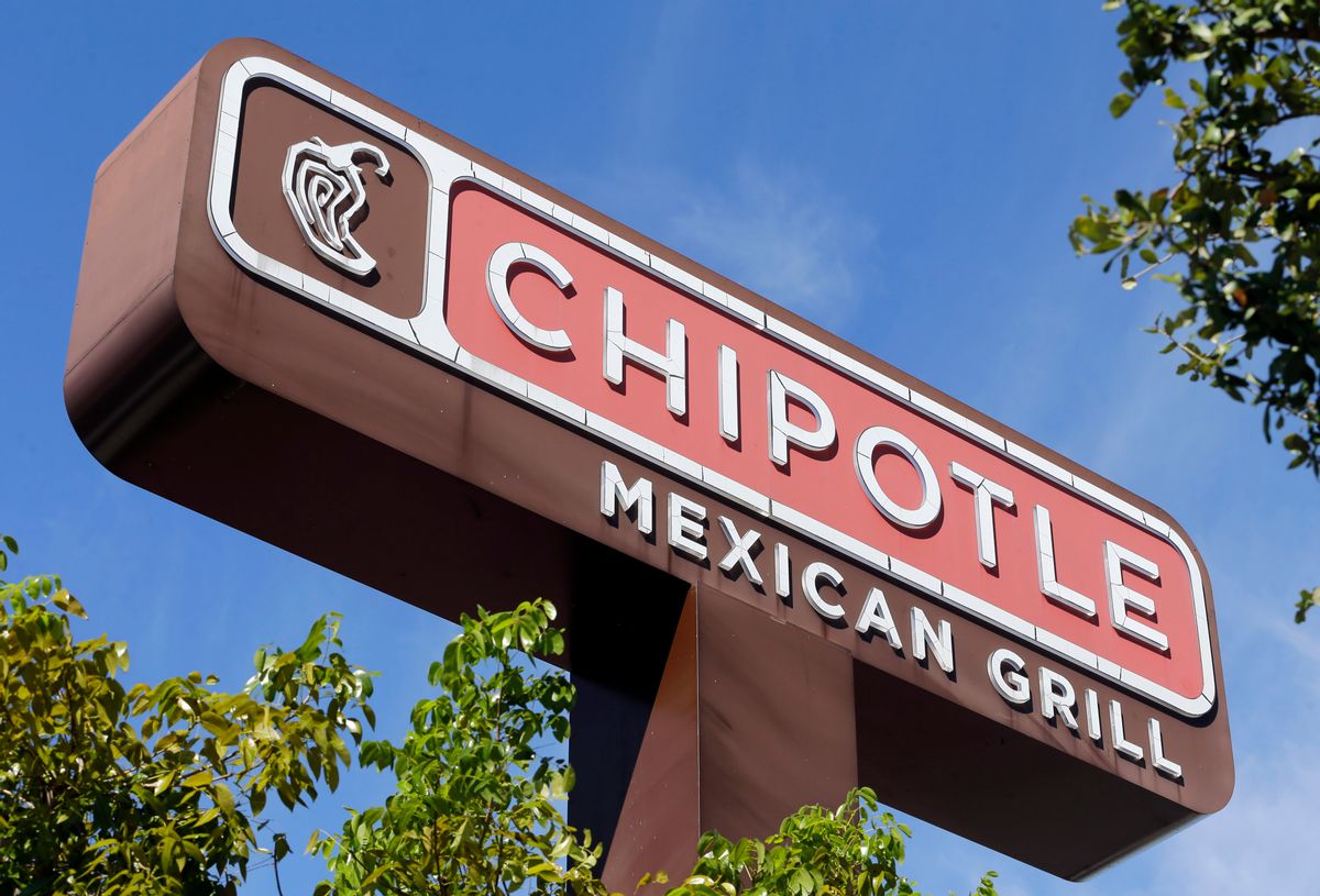 This Monday, Feb. 8, 2016, photo, shows the sign of a Chipotle restaurant in Hialeah, Fla. Chipotle is using free burrito offers to combat the eerie look of empty stores and convince people its safe to return. The offers come as Chipotle fights to recover from a series of food scares, with sales down 26 percent in February. () (AP Photo/Alan Diaz)