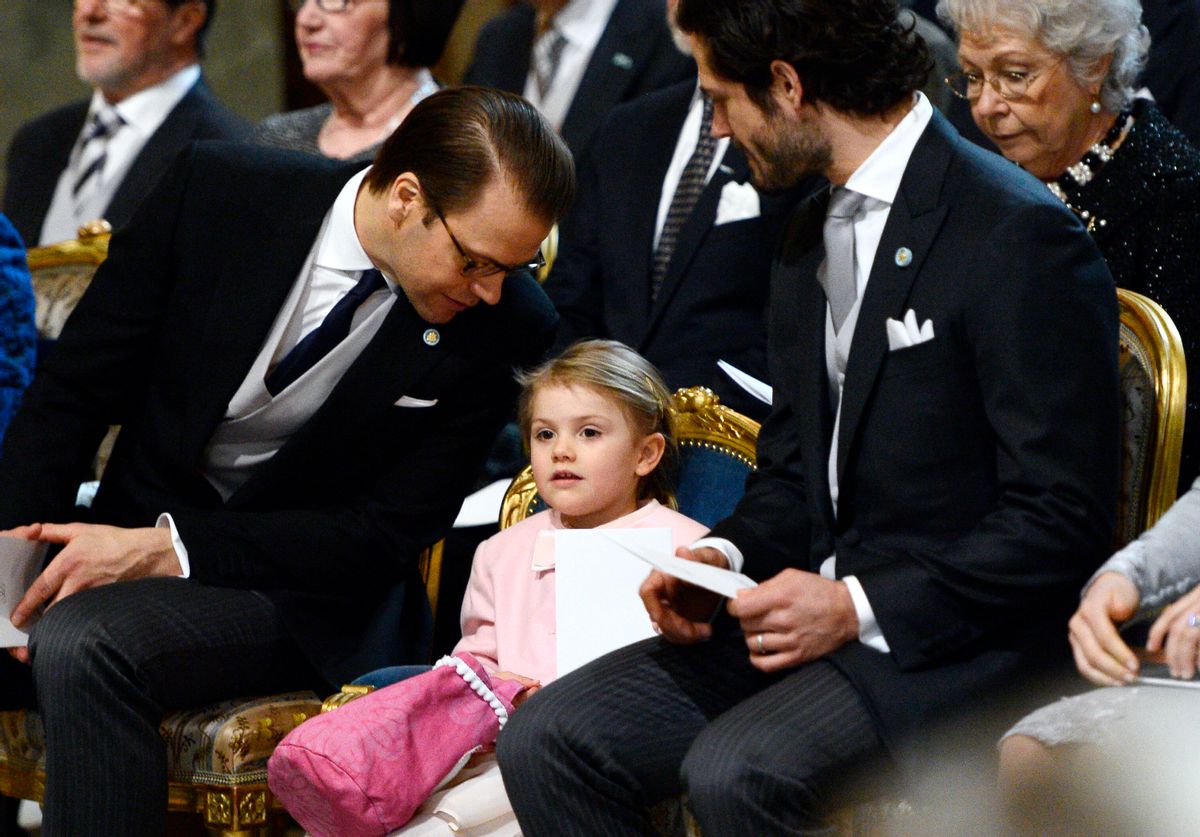 Sweden's Prince Daniel, left, talks to his daughter Princess Estelle as Prince Carl Philip looks on as they attend a thanksgiving service for the newborn prince, the second child of Crown Princess Victoria and Prince Daniel, in the palace church at Stockholm Royal Palace, Thursday March 3, 2016. The royal baby is third in line to the thrown after his mother and elder sister, Princess Estelle. (Anders Wiklund/TT via AP) SWEDEN OUT (AP)