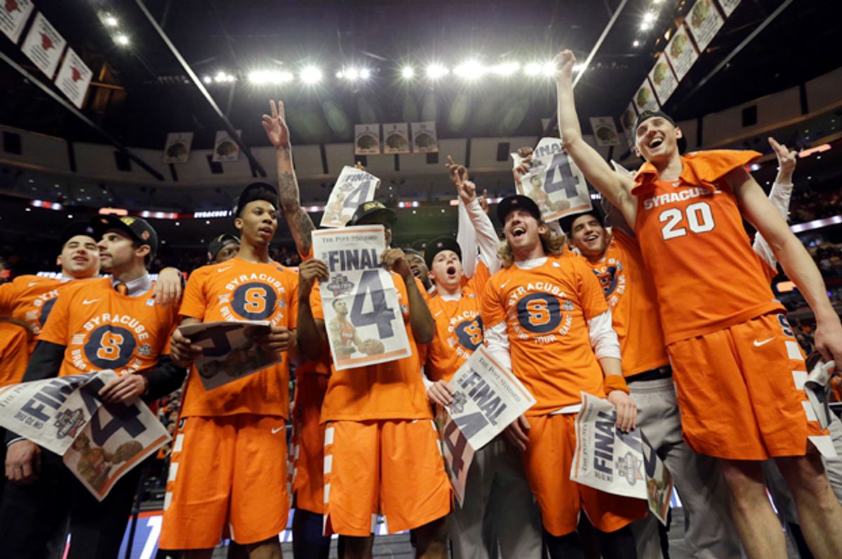 Syracuse players celebrate after beating Virginia in the regional finals of the NCAA Tournament, March 27, 2016, in Chicago.   (AP/Nam Y. Huh)