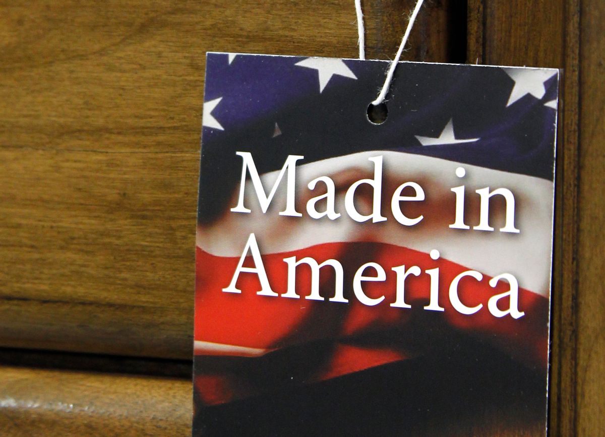 In this March 16, 2012 file photo, a "Made in America" tag hangs on a chest of drawers at a furniture factory in Lincolnton, N.C. The vast majority of Americans say they prefer lower prices instead of paying a premium for items labeled Made in the U.S.A., even if it means those cheaper items are made abroad, according to an Associated Press-GfK poll.  () (AP Photo/Bob Leverone, File)