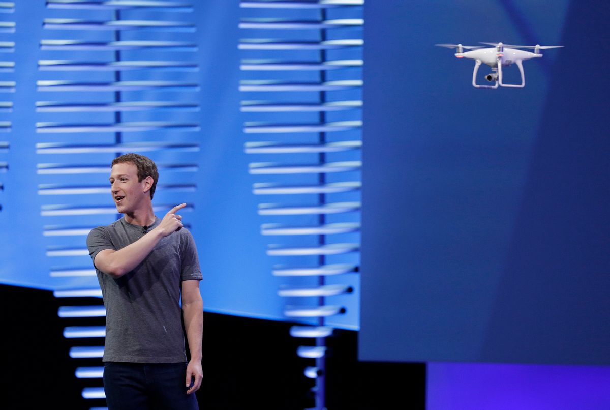 Facebook CEO Mark Zuckerberg points to a drone flying behind him during his keynote address at the F8 Facebook Developer Conference Tuesday, April 12, 2016, in San Francisco.  Zuckerberg said Facebook is releasing new tools that businesses can use to build "chatbots," or programs that can talk to customers in conversational language.  (AP Photo/Eric Risberg) (AP)