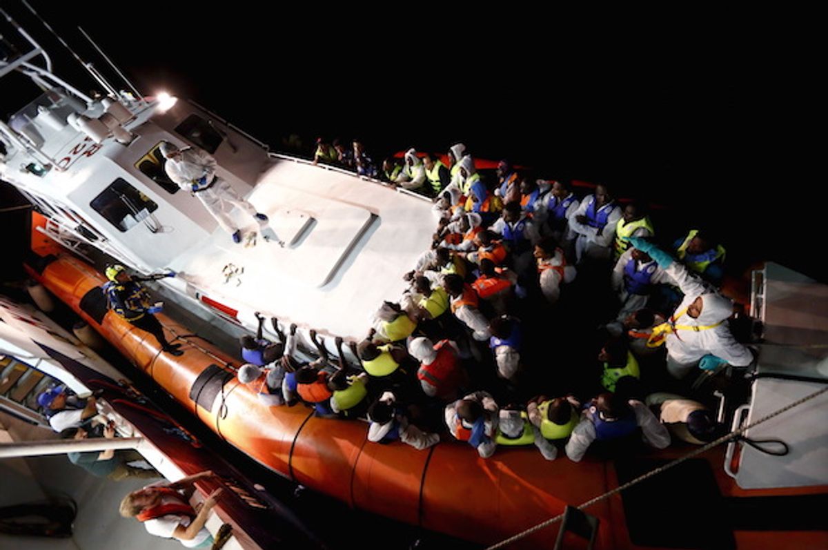 Refugees and migrants in an Italian Coast Guard vessel after traveling between Libya and the Italian island of Lampedusa, on August 3, 2015 (Reuters/Darrin Zammit Lupi)