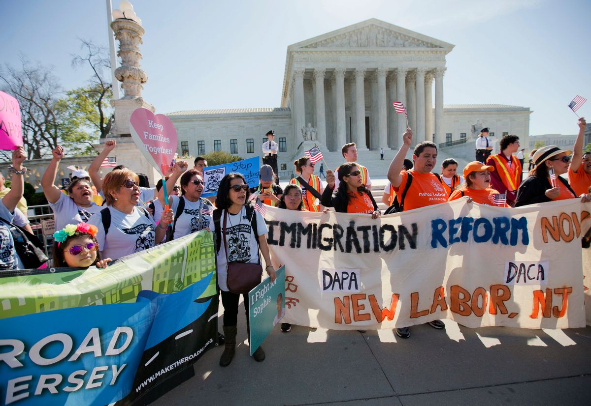 Supporters of fair immigration reform gather in front of the Supreme Court in Washington, Monday, April 18, 2016. The Supreme Court is taking up an important dispute over immigration that could affect millions of people who are living in the country illegally. The Obama administration is asking the justices in arguments today to allow it to put in place two programs that could shield roughly 4 million people from deportation and make them eligible to work in the United States. (AP Photo/Pablo Martinez Monsivais) (AP)