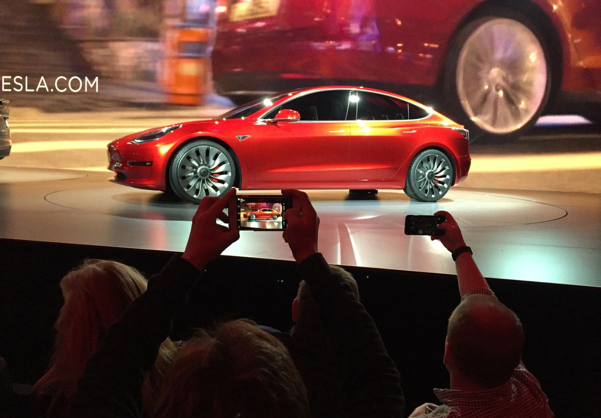 FILE - In this March 31, 2016 file photo, Tesla Motors unveils the new lower-priced Model 3 sedan at the Tesla Motors design studio in Hawthorne, Calif. More than 276,000 people pre-order the Tesla Model 3 in less than a week. Is it the Tesla phenomenon, or has the $35,000 electric car with a range of 200-plus miles taken finally taken the electric car to the masses. (AP Photo/Justin Pritchard) (AP)