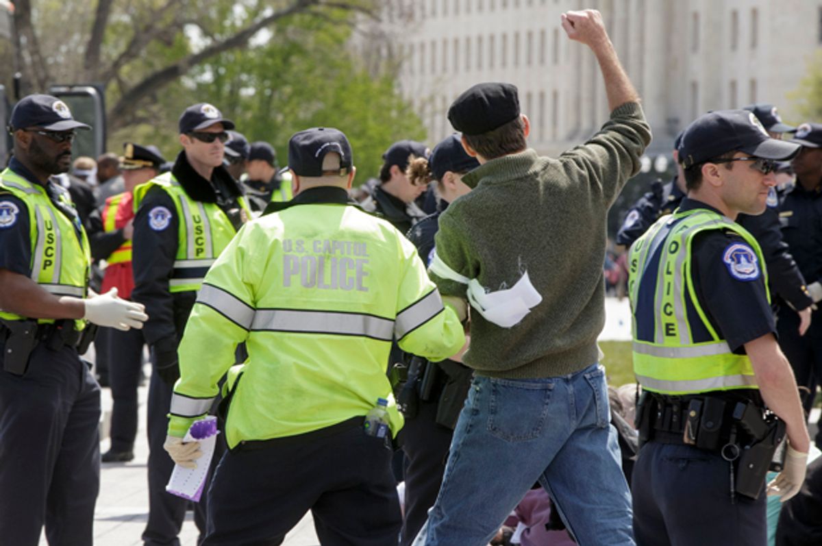 U.S. Capitol Police arrest voting rights reform demonstrators at the Capitol in Washington, April 11, 2016,.   (AP/J. Scott Applewhite)