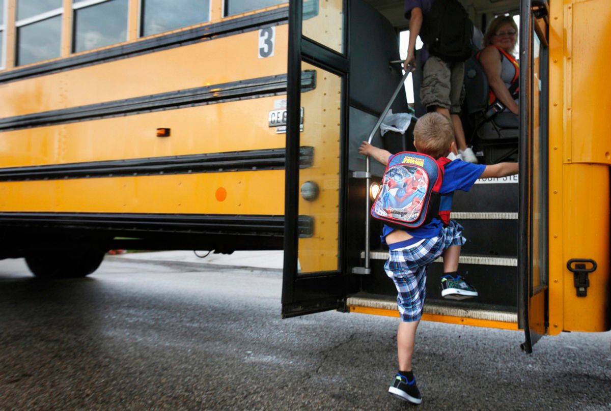 FILE - In this Sept. 4, 2012 file photo, a student at Indian Lake Elementary in Kalamazoo, Mich., boards a bus on the first day of school. Bullying is a serious public health problem, and should no longer be dismissed as merely a matter of kids being kids, a leading panel of experts warned Tuesday, May 10, 2016. Bullying behavior is seen as early as preschool and peaks during the middle school years, the researchers said. And the problem has morphed from the traditional bully-in-the-schoolyard scenario to newer forms of electronic aggression, such as cyberbullying on social media sites. (AP Photo/The Kalamazoo Gazette, Mark Bugnaski, File) (AP)