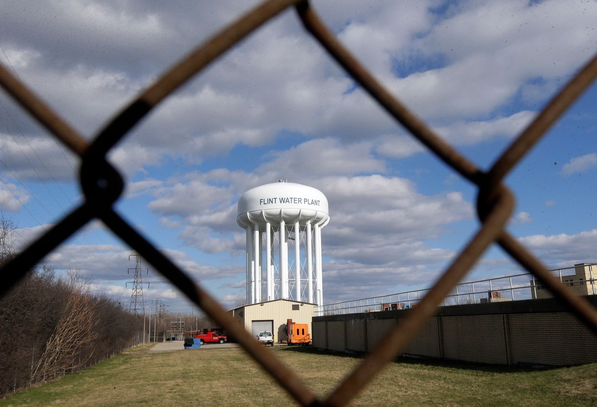 FILE - This March 21, 2016 file photo shows the Flint Water Plant water tower in Flint, Mich. Michigan Gov. Rick Snyder is calling for a halt of administrative investigations into how two state agencies dealt with the Flint drinking water crisis after being warned they are hampering state and federal criminal probes. Snyder's office released letters Thursday May 26, 2016, from the state attorney general and a federal prosecutor. (AP Photo/Carlos Osorio File) (AP)