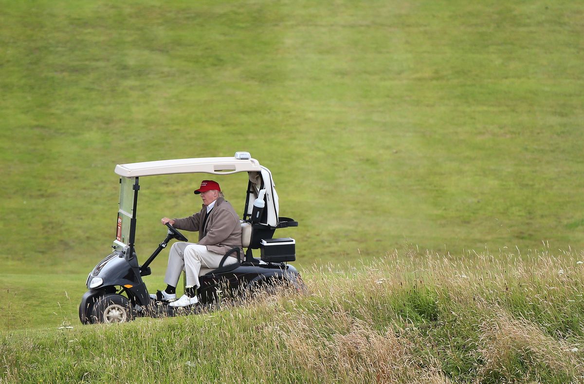 FILE - In this July 31, 2015 file photo, Republican presidential candidate Donald Trump drives his golf buggy during the second day of the Women's British Open golf championship on the Turnberry golf course in Turnberry, Scotland.  (AP)