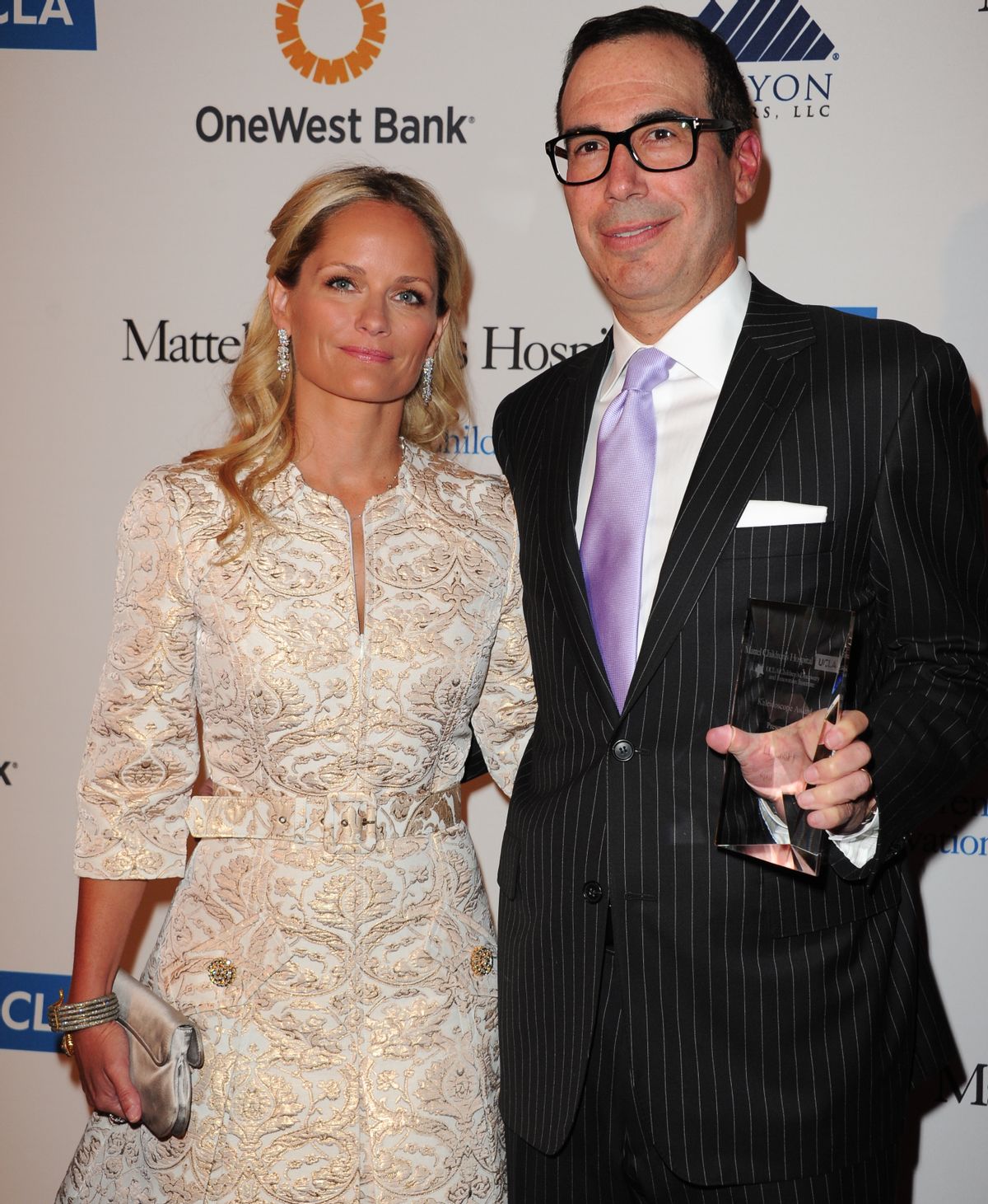 FILE - In this April 17, 2013 file photo, Heather Mnuchin, left, and Steven Mnuchin arrive at The Kaleidoscope Ball's "Designing The Future" at the Beverly Hills Hotel in Beverly Hills, Calif.  (Richard Shotwell/invision/ap)