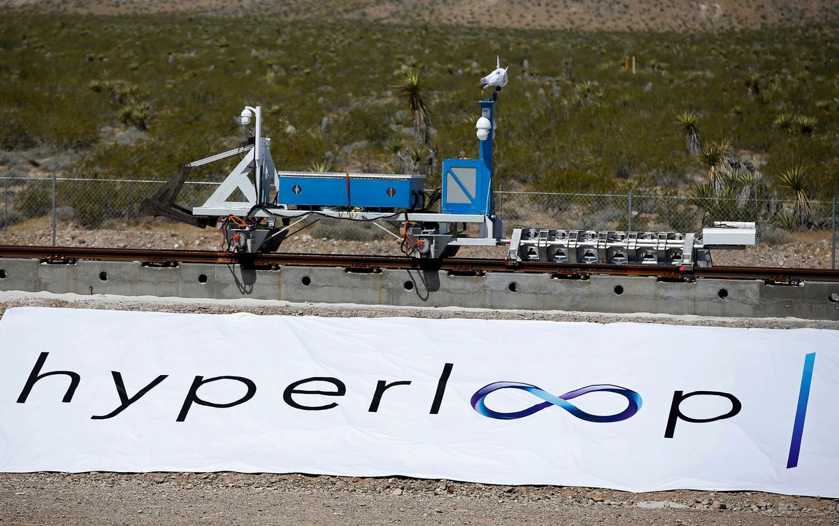 A recovery vehicle moves a sled down a track after a test of a Hyperloop One propulsion system, Wednesday, May 11, 2016, in North Las Vegas, Nev. The startup company opened its test site outside of Las Vegas for the first public demonstration of technology for a super-speed, tube based transportation system. (AP Photo/John Locher) (AP)
