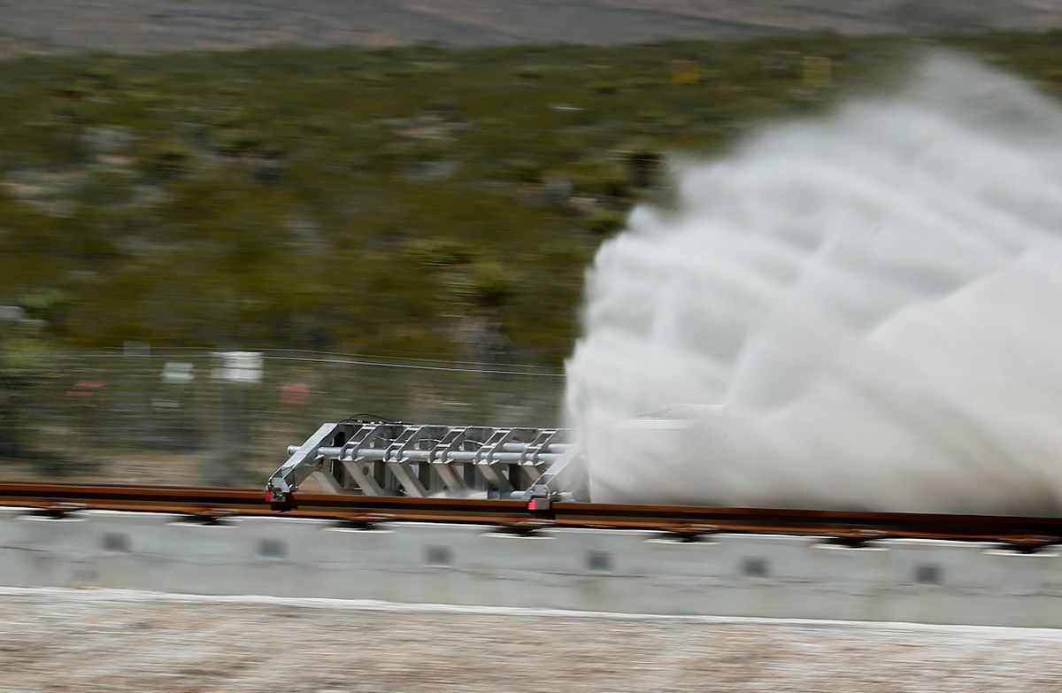 A sled speeds down a track during a test of a Hyperloop One propulsion system, Wednesday, May 11, 2016, in North Las Vegas, Nev. The startup company opened its test site outside of Las Vegas for the first public demonstration of technology for a super-speed, tube based transportation system. (AP Photo/John Locher) (AP)