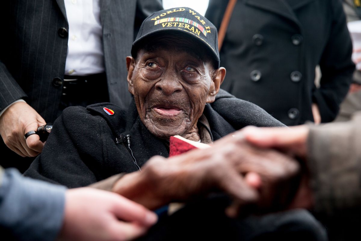 FILE - In this Dec. 7, 2015 file photo, Frank Levingston Jr., of Lake Charles, La.,  is greeted by visitors following a wreath laying ceremony to mark the anniversary of Pearl Harbor at the World War II Memorial in Washington.  Levingston, a 110-year-old veteran who served in World War II has died, on Tuesday, May 3, 2016.  () (AP Photo/Andrew Harnik)
