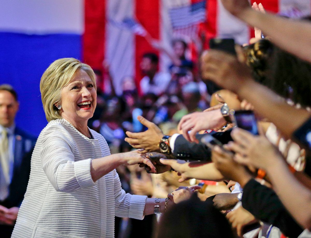 Democratic presidential candidate Hillary Clinton greets supporters as she arrives to speak during a presidential primary election night rally, Tuesday, June 7, 2016, in New York. (AP Photo/Julie Jacobson) (AP)