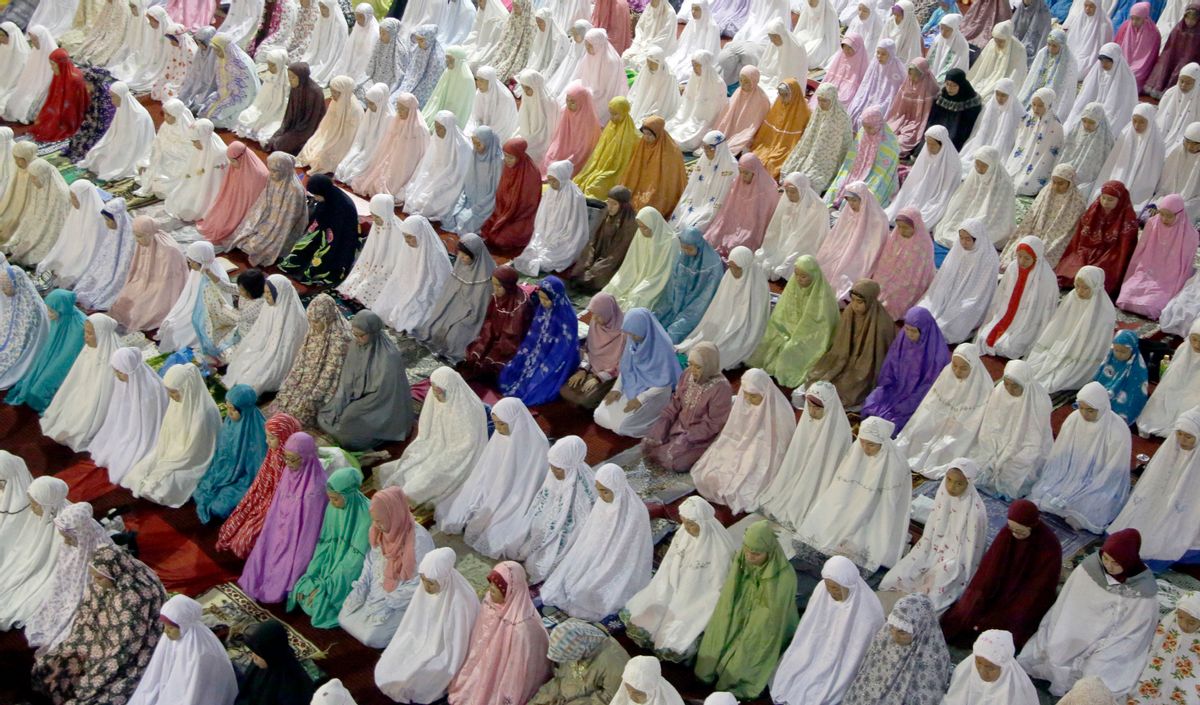 Muslim women perform an evening prayer called 'tarawih' marking the first eve of the holy fasting month of Ramadan, at Istiqlal Mosque in Jakarta, Indonesia, Sunday, June 5, 2016. During Ramadan, the holiest month in Islamic calendar, Muslims refrain from eating, drinking, smoking and sex from dawn to dusk. (AP Photo/Tatan Syuflana) (AP Photo/Tatan Syuflana))