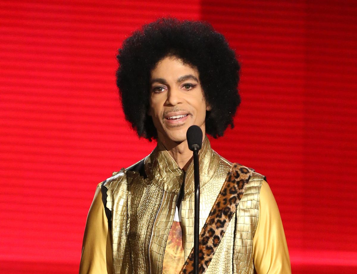 FILE - In this Nov. 22, 2015 file photo, Prince presents the award for favorite album - soul/R&amp;B at the American Music Awards in Los Angeles. A law-enforcement official says that tests show the music superstar died of an opioid overdose. Prince was found dead at his home on April 21, 2016, in suburban Minneapolis. He was 57. (Photo by Matt Sayles/Invision/AP, File) (Matt Sayles/Invision/AP)
