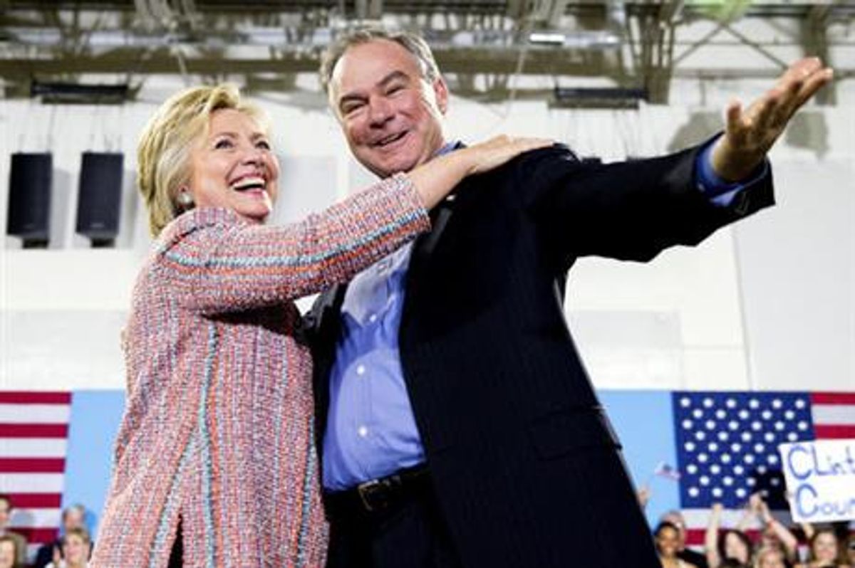 In this July 14, 2016, file photo, Democratic presidential candidate Hillary Clinton, accompanied by Sen. Tim Kaine, D-Va., speaks at a rally at Northern Virginia Community College in Annandale, Va. Clinton has chosen Kaine to be her running mate  ((AP Photo/Andrew Harnik))