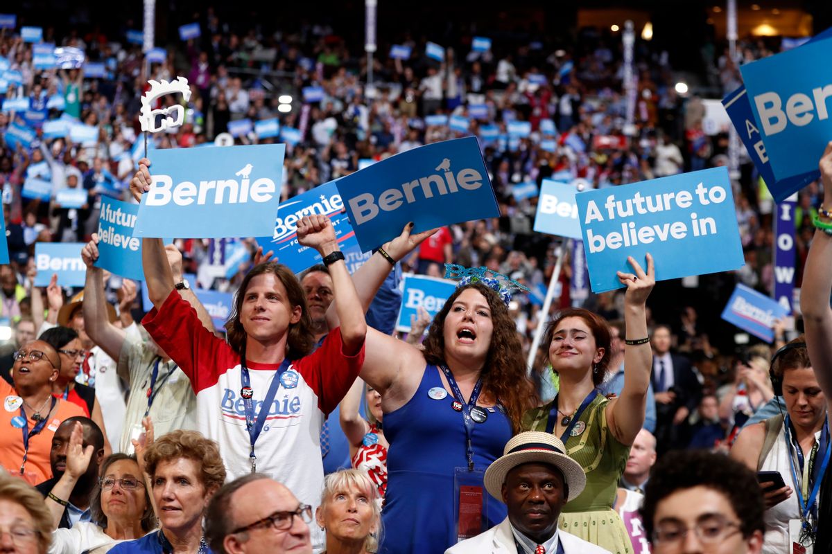 Delegates cheer as former Democratic Presidential candidate Sen. Bernie Sanders during the first day of the Democratic National Convention (AP)