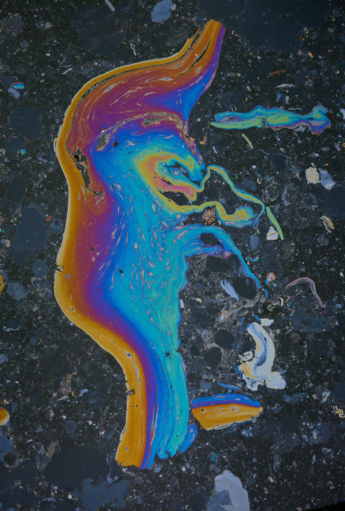 In this Friday, July 1, 2016 photo, a rainbow-color waste slick appears on Brooklyn's Gowanus Canal, in New York. The canal is a Superfund site polluted with decades' worth of industrial waste and sewage, but the developer says the pending more than half a billion dollars cleanup of the toxic waterway hasn't deterred tenants from flocking to the building, where the rent for a one-bedroom apartment starts in the low $3,000s. (AP Photo/Bebeto Matthews) (AP)
