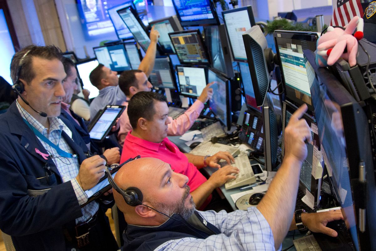 Greg Rowe, left, and Vincent Napolitano, bottom, with Livermore Trading Group, monitor stock prices at the New York Stock Exchange, Friday, July 22, 2016. (AP Photo/Mark Lennihan) (AP)
