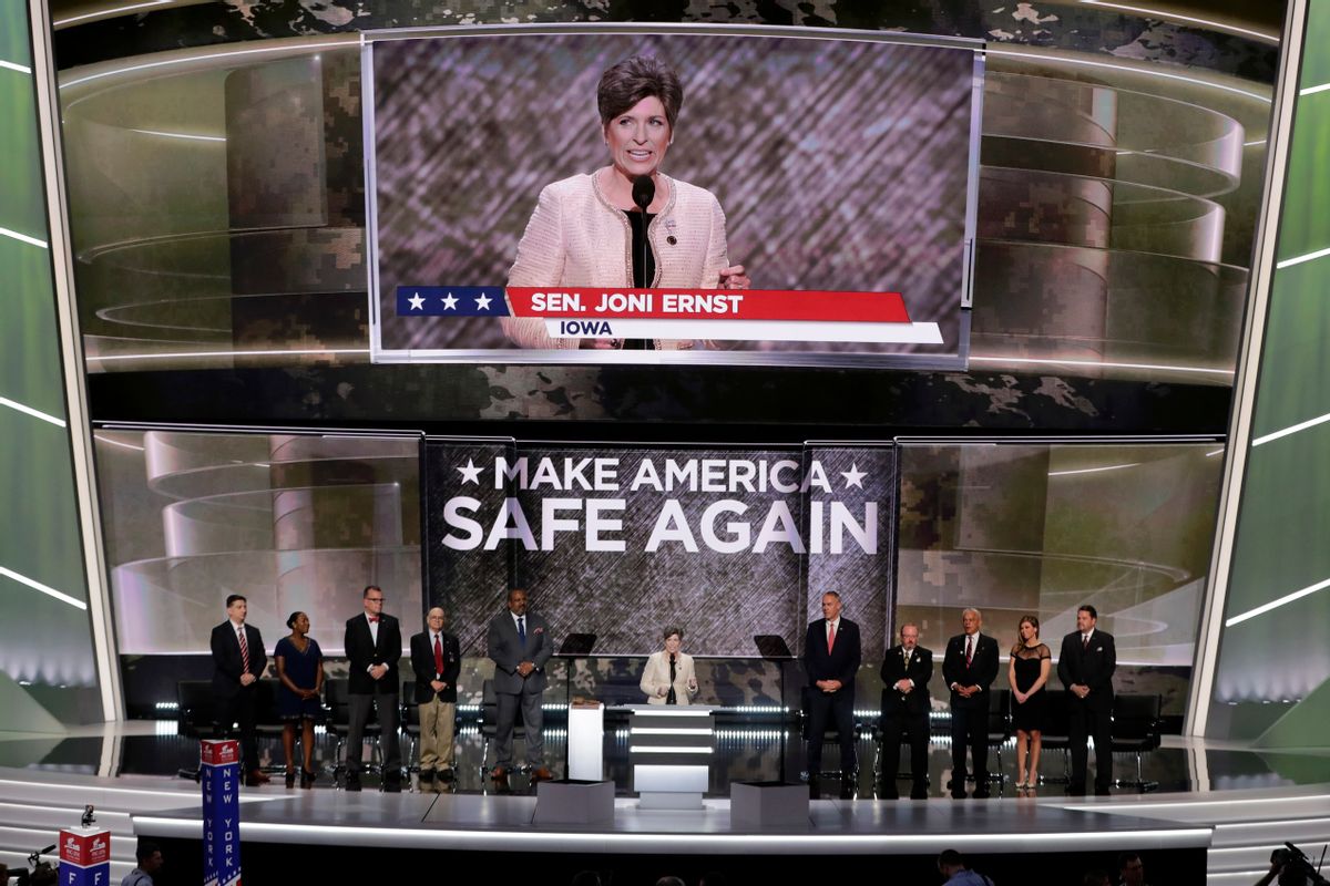 Sen. Joni Ernst, R-Iowa, stands with veterans as she addresses the delegates during the opening day of the Republican National Convention in Cleveland, Monday, July 18, 2016. (AP Photo/J. Scott Applewhite) (AP)