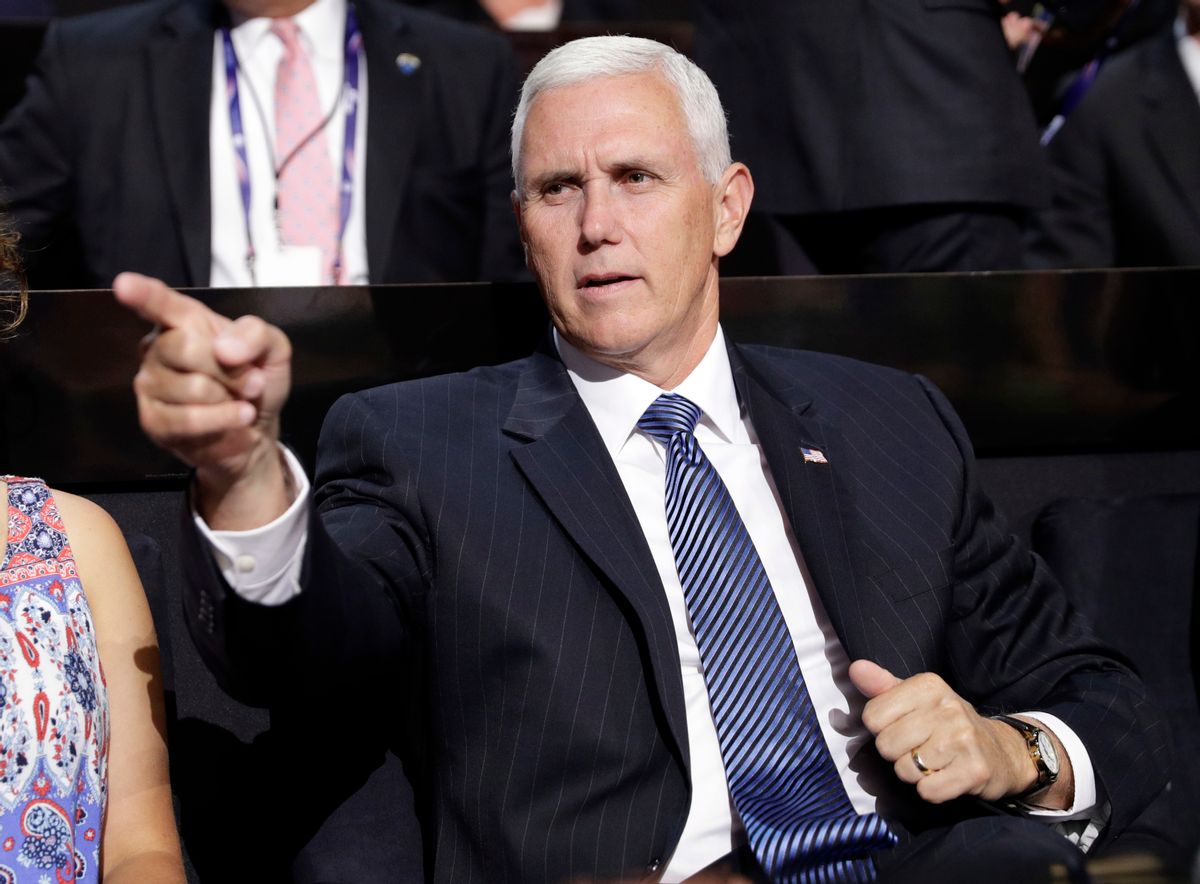 Vice Presidential nominee Gov. Mike Pence of Indiana points as he sits during the second day session of the Republican National Convention in Cleveland, Tuesday, July 19, 2016. (AP Photo/John Locher) (AP)