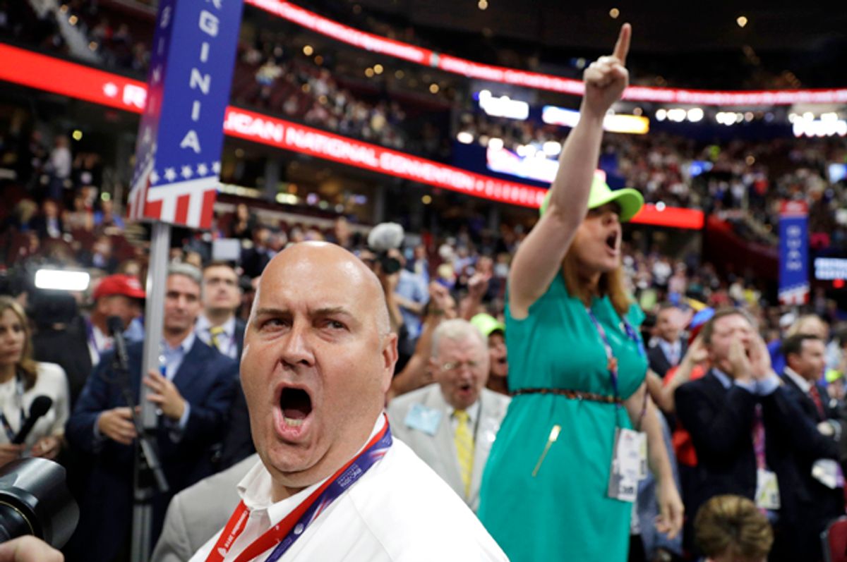 Delegates react as some call for a roll call vote on the adoption of the rules at the Republican National Convention in Cleveland, July 18, 2016.   (AP/John Locher)