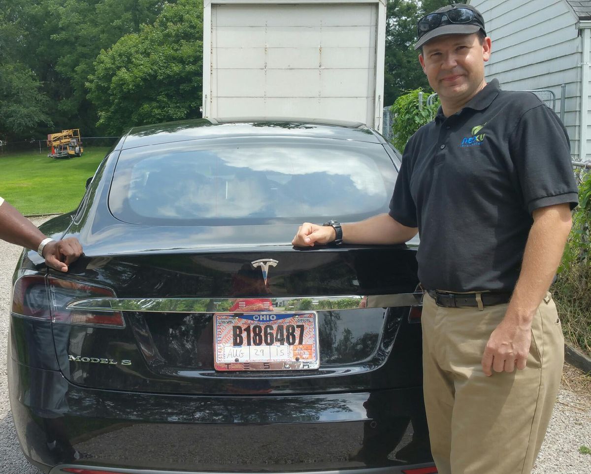 In this 2015 photo provided by his neighbor, Krista Kitchen, Joshua Brown stands by his new Tesla electric car near his home in Canton, Ohio. Brown died in an accident in Florida on May 7, 2016 in the first fatality from a car using self-driving technology. According to statements by the government and the automaker, his vehicle's cameras didn't make a distinction between the white side of a turning tractor-trailer and the brightly lit sky while failing to automatically activate its brakes. (Krista Kitchen via AP) (AP)