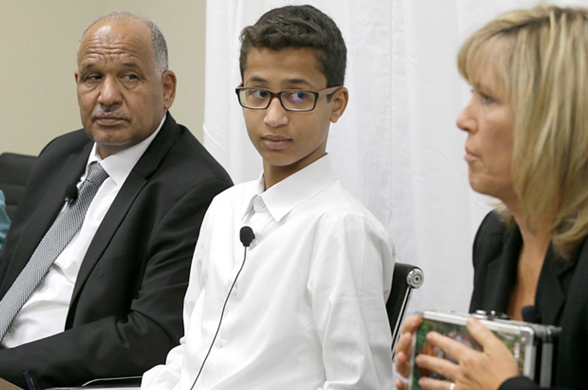 Ahmed Mohamed and father Mohamed Elhassan Mohamed look on as their lawyer Susan E. Hutchison speaks at a news conference in Dallas, Aug. 8, 2016.    (AP/LM Otero)