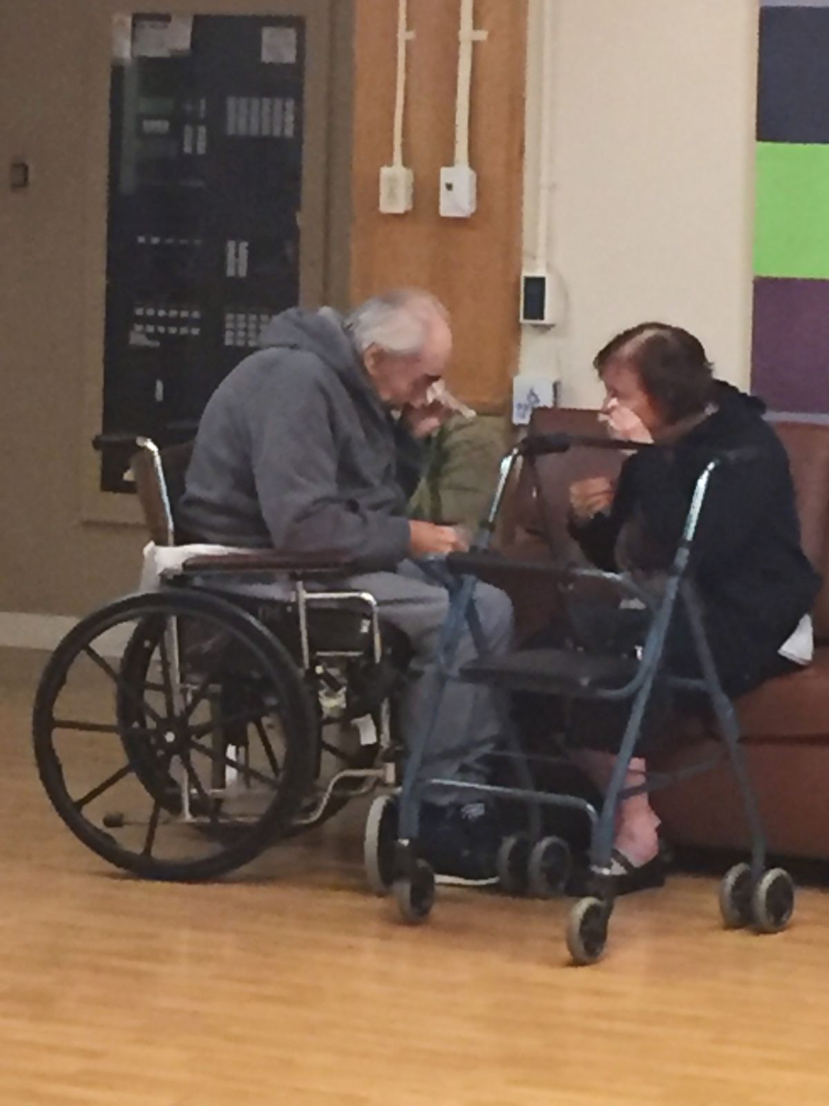 In this Monday, Aug. 22, 2016 photo provided by Ashley Bartyik, her grandparents Wolfram and Anita Gottschalk of Surrey, British Columbia, Canada, cry as they say goodbye near the end of a visit with each other in Wolfram's elderly care home in Surrey. The couple, who are in their 80s, were separated into two different care homes a half an hour apart after 62 years of marriage because no beds were available together. (Ashley Bartyik via AP) (AP)