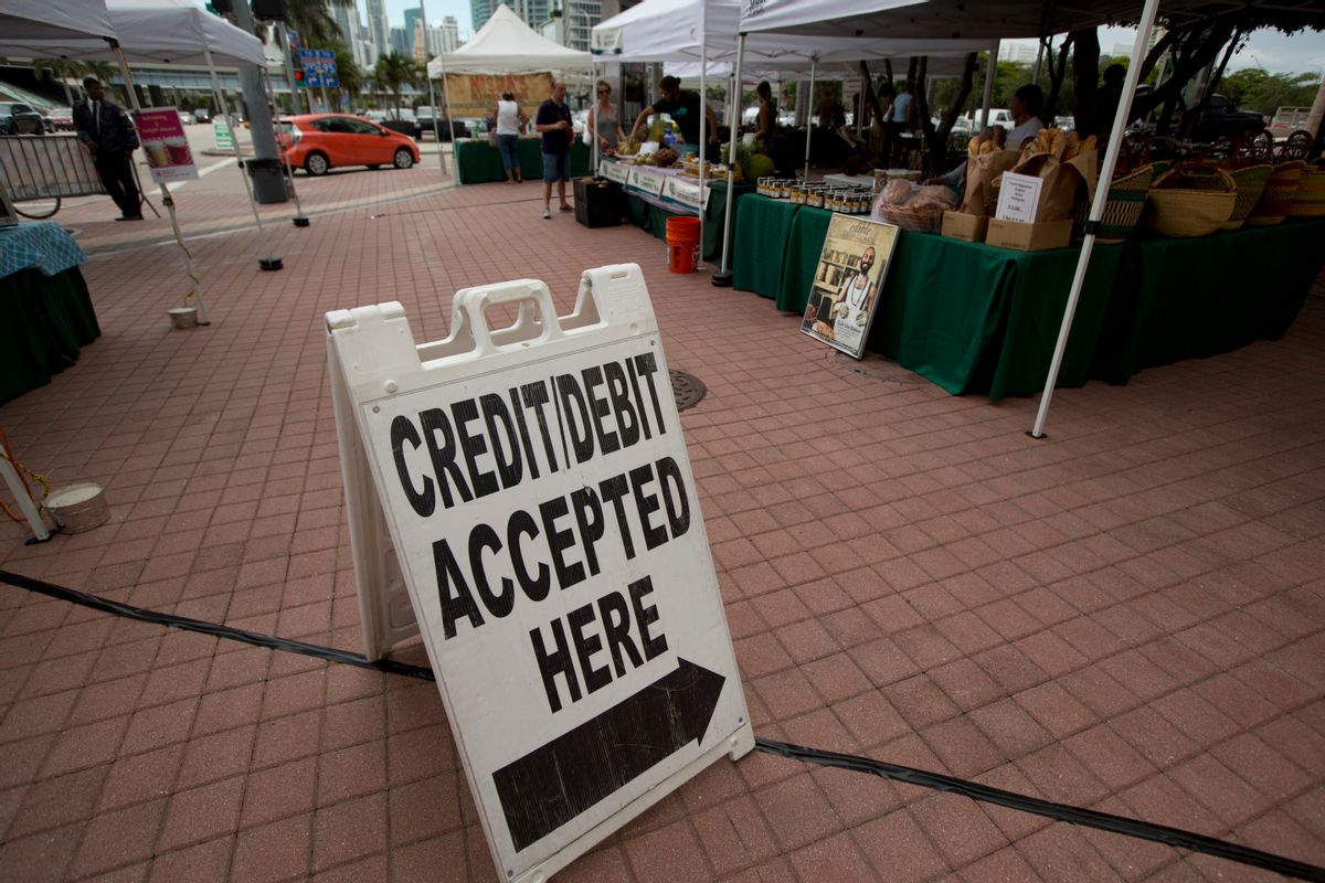 FILE - In this June 8, 2015, file photo, credit card customers are directed to a pay station at the green market in downtown Miami. On Friday, Aug. 5, 2016, the Federal Reserve releases its June report on consumer borrowing. (AP Photo/J Pat Carter, File) (AP)