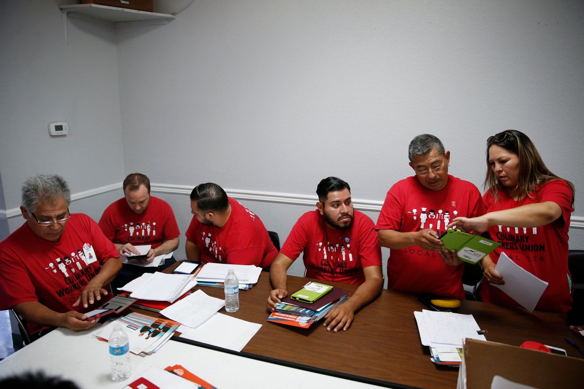 In this June 13, 2016 photo, members of Culinary Union Local 226 meet at their union hall in Las Vegas to prepare to canvass for Ruben Kihuen, a Hispanic candidate for congress. Half of the union's predominantly-immigrant members are Hispanic, and it has harnessed Sin City's housekeepers, cooks and janitors and turned them into an electoral powerhouse. (AP Photo/John Locher) (AP)