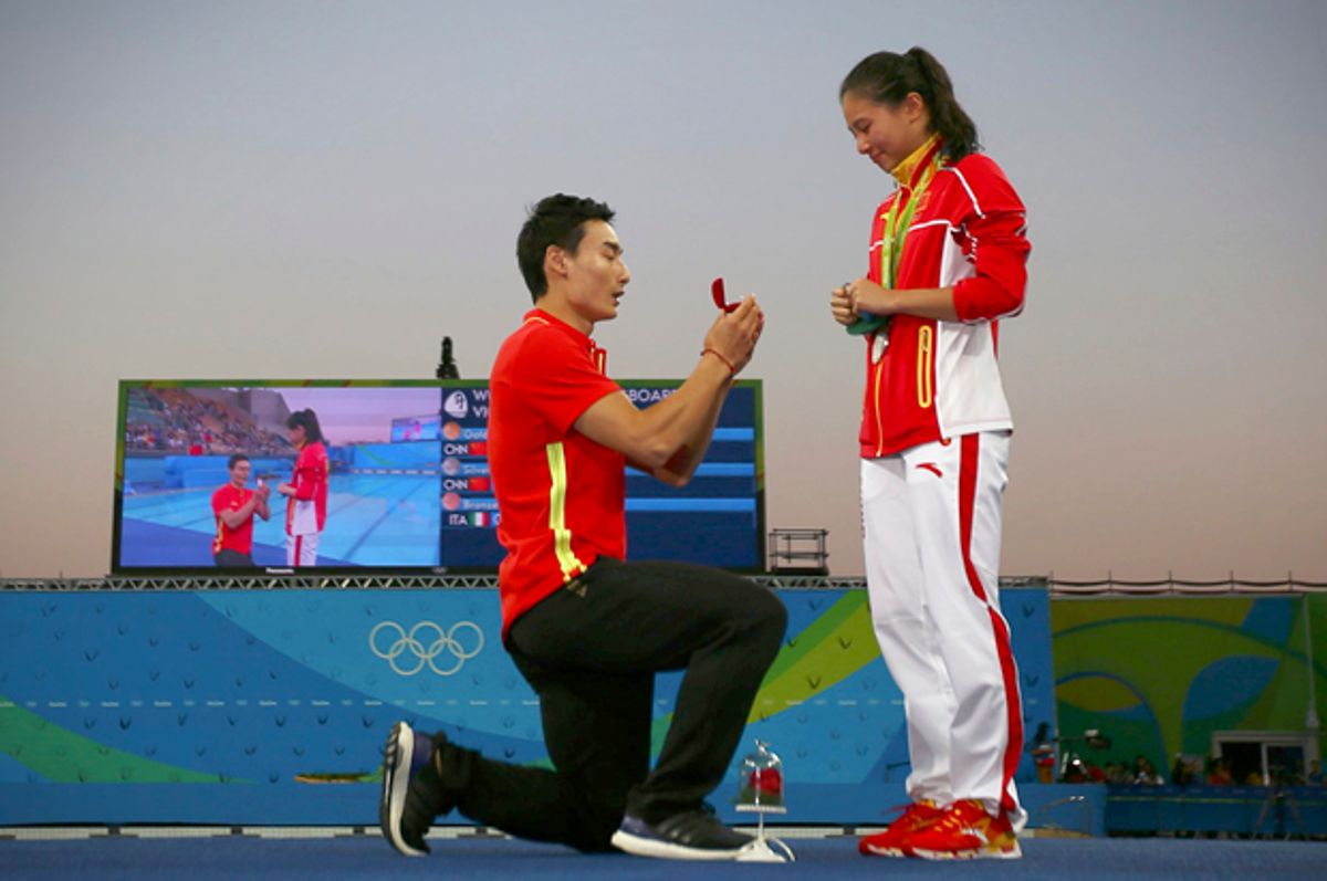 He Zi receives a marriage proposal from Olympic diver Qin Kai after her medal ceremony, Rio de Janeiro, August 14, 2016.   (Reuters/Michael Dalder)