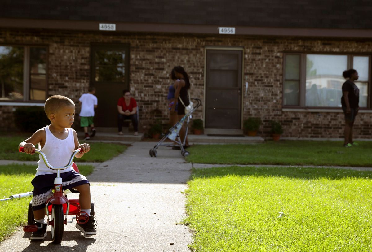In this Aug. 3, 2016 photo, Joseph Russell, 2, rides his tricycle outside his home at the West Calumet Housing Complex in East Chicago, Ind. More than 1,000 residents of a public housing complex in northwest Indiana have been left in a state of panic and uncertainty since authorities informed them last month that their homes need to be destroyed because of a serious lead contamination threat. (Jonathan Miano/The Times via AP) (AP)