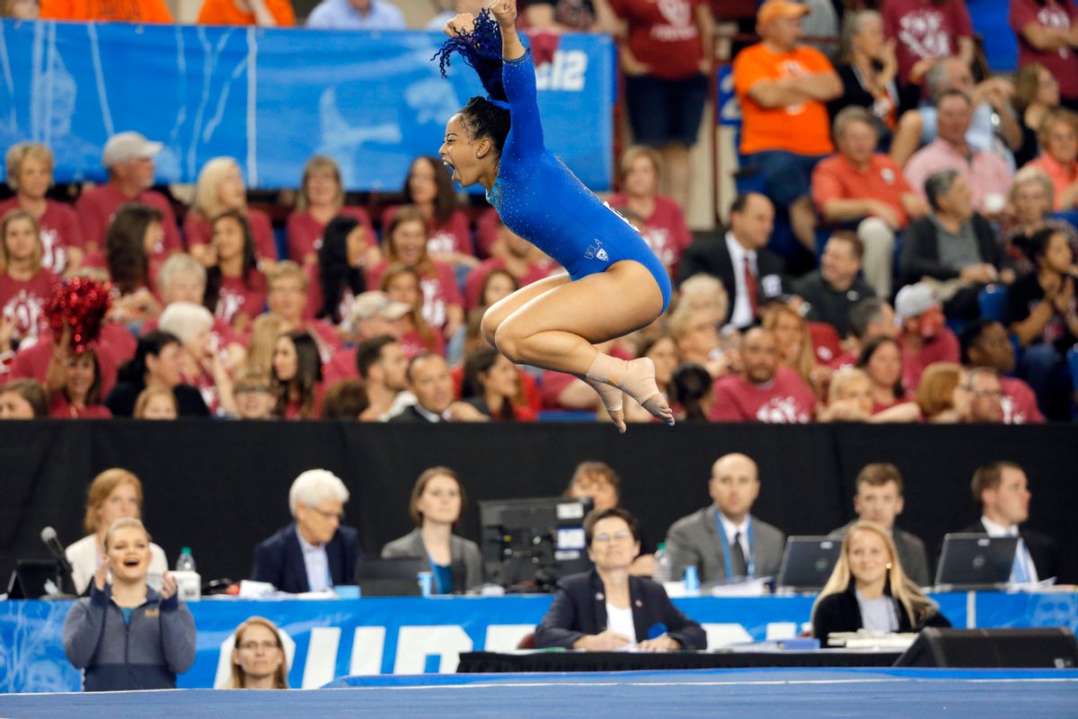 FILE - In this April 16, 2016, file photo, UCLA's Sophina DeJesus celebrates after her floor exercise routine during the NCAA women's gymnastics championships in Fort Worth, Texas. (AP Photo/Tony Gutierrez, File) (AP)