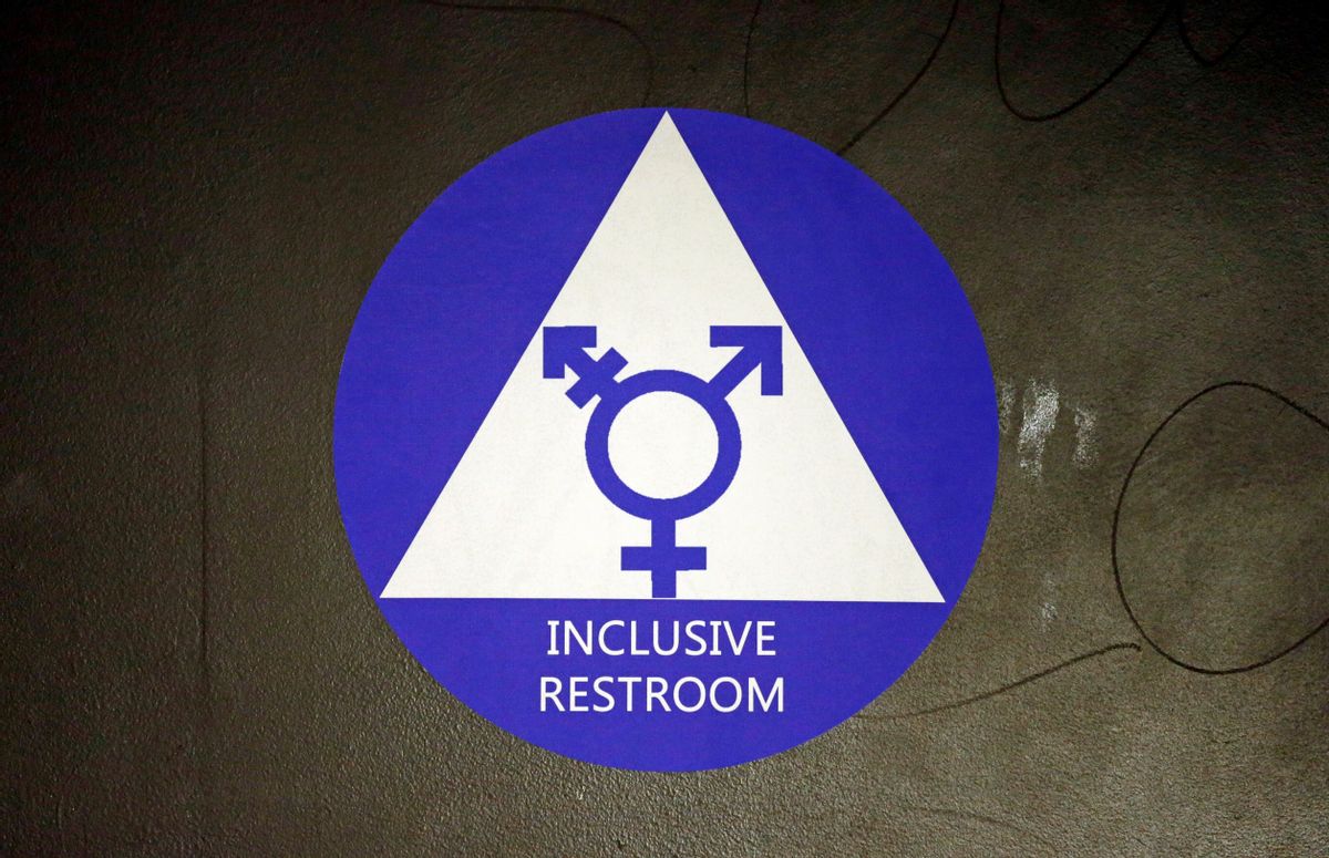 FILE - In this May 17, 2016, file photo, a new sticker designates a gender neutral bathroom at Nathan Hale high school in Seattle. A federal judge in Texas is blocking for now the Obama administration's directive to U.S. public schools that transgender students must be allowed to use the bathrooms and locker rooms consistent with their chosen gender identity. () (AP Photo/Elaine Thompson, File)