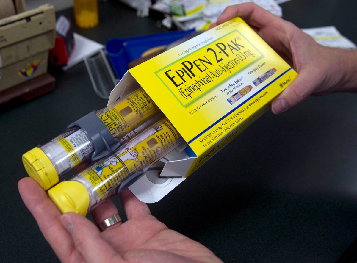 FILE - In this July 8, 2016, file photo, a pharmacist holds a package of EpiPens epinephrine auto-injector, a Mylan product, in Sacramento, Calif. Mylan said it will make available a generic version of its EpiPen, as criticism mounts over the price of its injectable medicine. (AP Photo/Rich Pedroncelli, File) (AP)