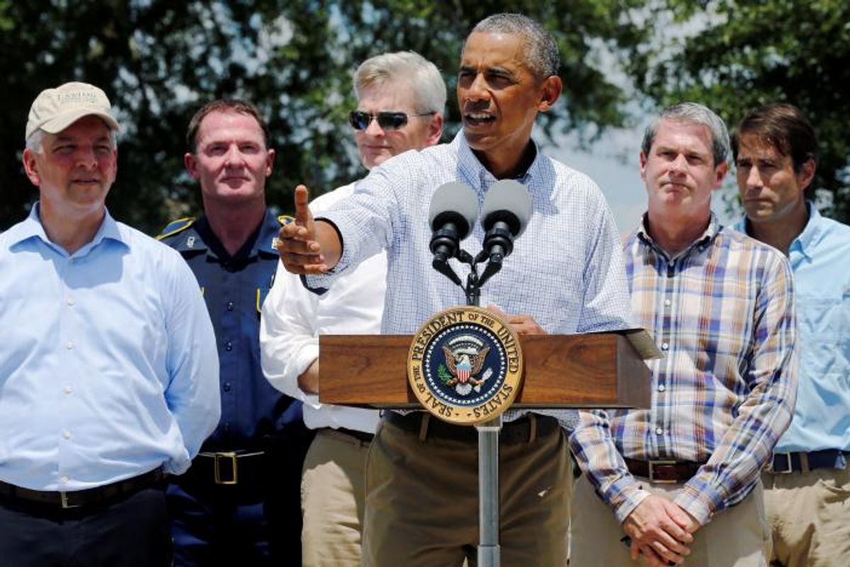 U.S. President Barack Obama (C), flanked by elected officials including Louisiana Governor John Bel Edwards (L) delivers remarks after touring a flood-affected neighborhood in Zachary, Louisiana, U.S. August 23, 2016. REUTERS/Jonathan Ernst (Reuters)