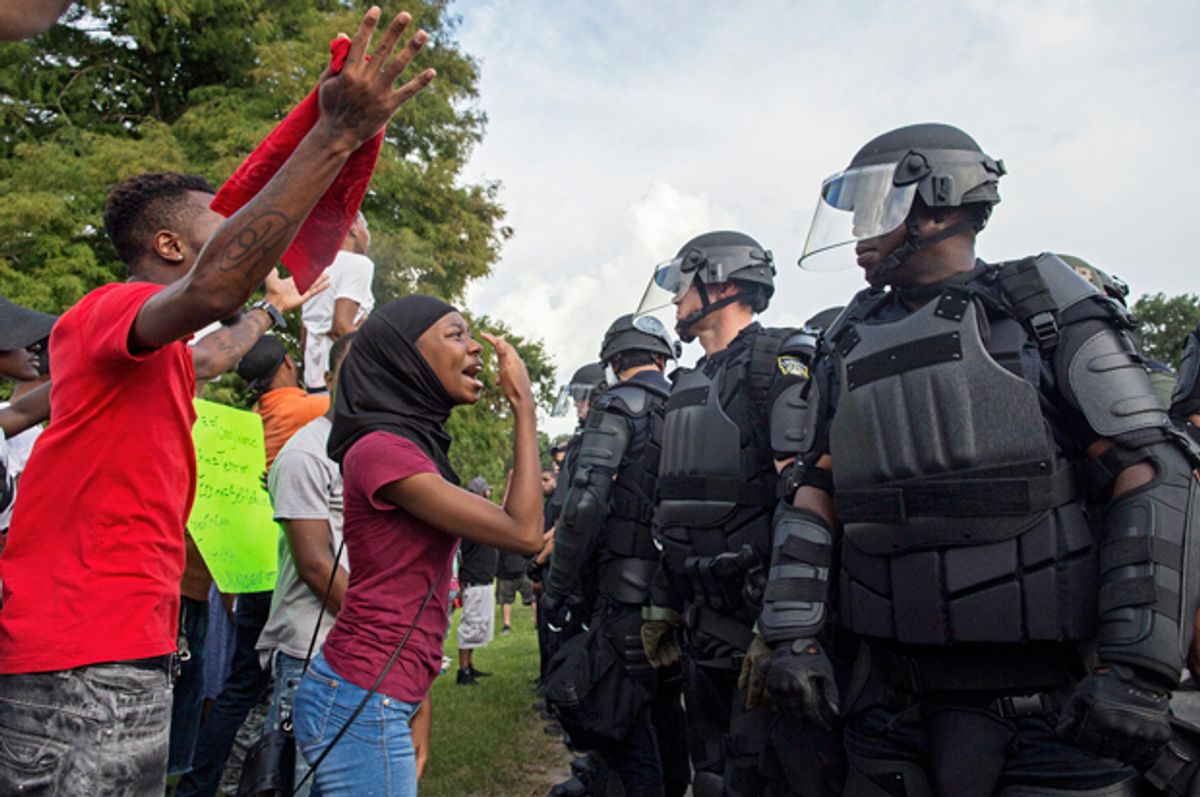 Protesters confront police officers in Baton Rouge, July 9, 2016.    (AP/Max Becherer)