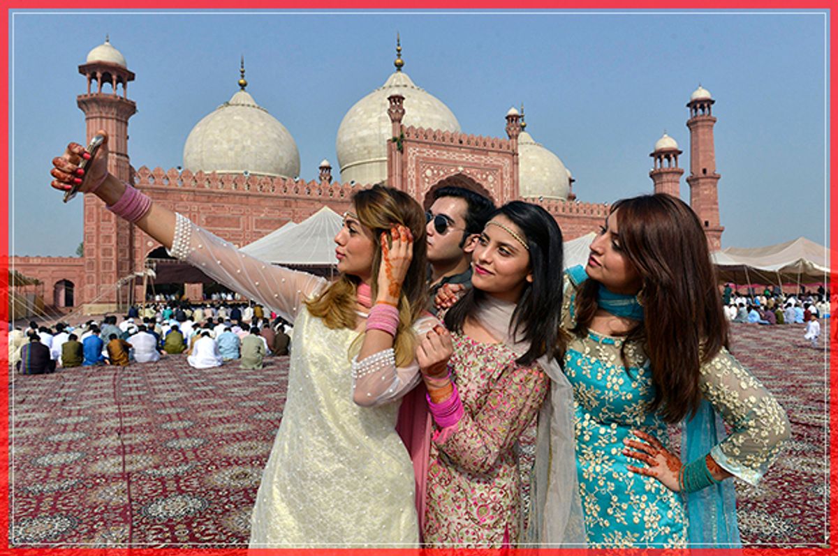 Pakistani Muslims pose for selfie after attending Eid al-Adha prayers in Lahore on September 13, 2016.
Muslims across the world celebrate the annual festival of Eid al-Adha, or the Festival of Sacrifice, which marks the end of the Hajj pilgrimage to Mecca and in commemoration of Prophet Abraham's readiness to sacrifice his son to show obedience to God. / AFP / ARIF ALI        (Photo credit should read ARIF ALI/AFP/Getty Images) (Afp/getty Images)