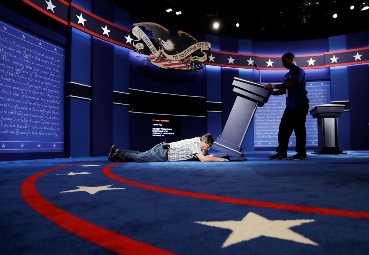 Technicians set up the stage for the presidential debate between Democratic presidential candidate Hillary Clinton and Republican presidential candidate Donald Trump. (AP)