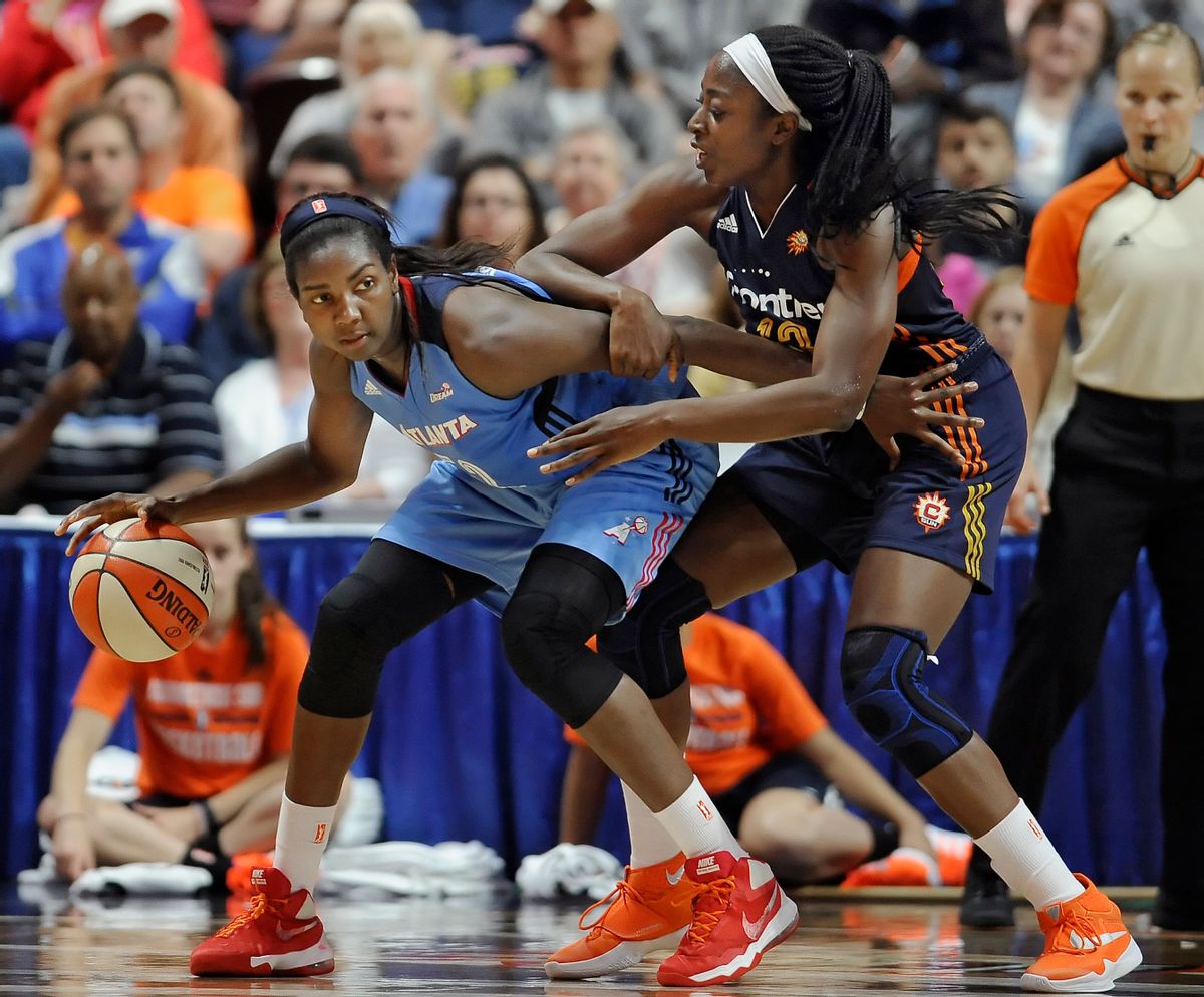 FILE - In this July 10, 2016, file photo, Atlanta Dream's Elizabeth Williams, left, is guarded by Connecticut Sun's Chiney Ogwumike during the second half of a WNBA basketball game in Uncasville, Conn. Atlanta’s Elizabeth Williams was voted the most improved player, Tuesday, Sept. 20, 2016. (AP Photo/Jessica Hill, File) (AP)