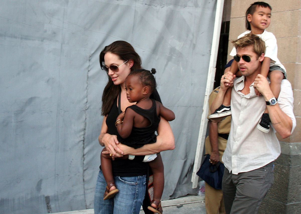 FILE - In this Nov. 12, 2006 file photo, American actress and UNHCR Ambassador Angelina Jolie, left, with her daughter Zahara, and Brad Pitt, right, with Jolie's son Maddox, walk near the Gateway of India in Mumbai, India. Angelina Jolie Pitt has filed for divorce from Brad Pitt, bringing an end to one of the world's most star-studded, tabloid-generating romances. An attorney for Jolie Pitt, Robert Offer, said Tuesday, Sept. 20, 2016, that she has filed for the dissolution of the marriage. (AP Photo, File) (AP Photo, File)